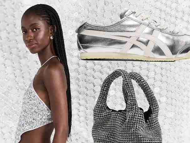 A close-up of a shimmering silver Giarite Brilly handbag, crafted from rhinestone crystals, lying on a light-colored surface next to a silver Onitsuka Tiger Mexico 66 shoe and a person.