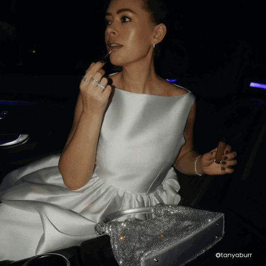 Woman in All Silver with Giarite's Handbag